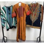 3 vintage ethnic items of clothing. A long line short sleeved jacket with heavily embroidered