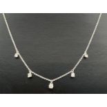 A Luke Stockley, London, 18ct white gold and diamond waterfall style necklace. 18 inch fine