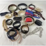 A collection of vintage belts in varying style and sizes. To include leather, cotton and chain.