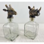 2 modern square shaped decanters with stoppers modelled as animal heads - a rhino and a giraffe.