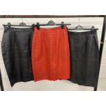 3 vintage leather knee length midi skirts, in black and red. All with approx. 26" waist.