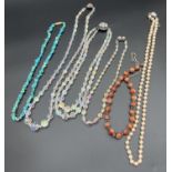 A collection of assorted vintage beaded necklaces, to include turquoise chips, faux pearls with