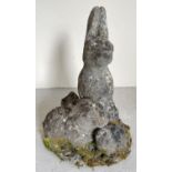 A large weathered concrete garden ornament of rabbits. Approx. 46cm tall.