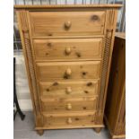 A modern pine 6 drawer chest with twisted column detail and knob handles. With solid wood drawers (