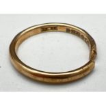 A vintage 9ct gold wedding band - cut through, for scrap or repair. Fully hallmarked inside band.