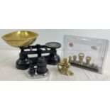 A set of black metal Salter kitchen scales with brass dish and 2 sets of weights - one in plastic
