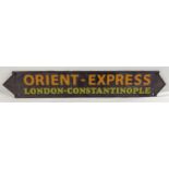 A painted cast iron Orient Express wall plaque, with fixing holes. Approx. 57cm long.