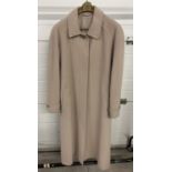 A vintage beige wool and cashmere full length coat with collar, front hidden button fastening and