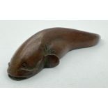 A signed miniature Japanese bronze, modelled as a catfish. Impressed signature to underside. Approx.