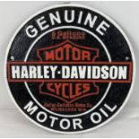 A Harley Davidson Motor Oil circular shaped painted cast iron wall plaque. In black, white and red