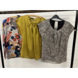 3 designer tops. An abstract design blouse by Vilagallo, size 44, a mustard patterned top by