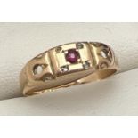 An Art Deco 15ct gold ring set with ruby and diamonds - 2 stones missing, band cut through.