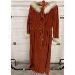 A vintage handmade burnt orange velvet coat dress with gathered waist, front button fastening,