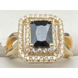 A new with tags 14kt gold plated cocktail ring set with Swarovski crystals. Square cut black stone