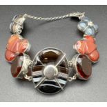 A vintage white metal, Scottish agate and citrine bracelet. Shaped pieces of agate in varying