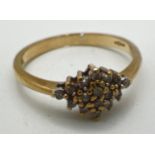 A 9ct gold 0.15ct diamond cluster style ring, hallmarked inside band. Ring size O. Total weight