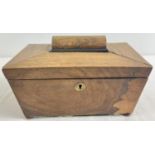 An antique sarcophagus shaped wooden tea caddy with bun feet and brass escutcheon. 2 interior lidded