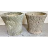 A pair of small vintage circular shaped concrete garden planters with Tudor design floral detail.