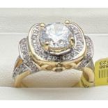 A 14kt gold plated Swarovski crystal set cocktail ring, new with tags. Decorative high shoulder