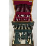 2 vintage wooden cased cutlery canteens. A 1940's part canteen with complete fish set, together with
