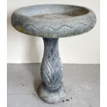 A large modern concrete garden bird bath with floral design to base. 2 sectional, approx. 60cm