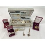 A vintage jewellery box and contents to include earrings, rings and necklaces. Together with some