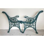 A pair of cast iron bench ends, painted green with lions head detail. Approx. 70cm tall x 58cm wide.