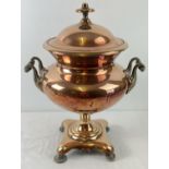 A Victorian copper samovar with stepped feet and turned wooden handles - no spigot.