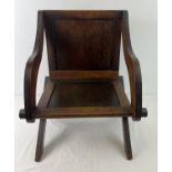 A vintage dark wood child's X frame chair with panelled seat & back and shaped arms. Approx. 55cm