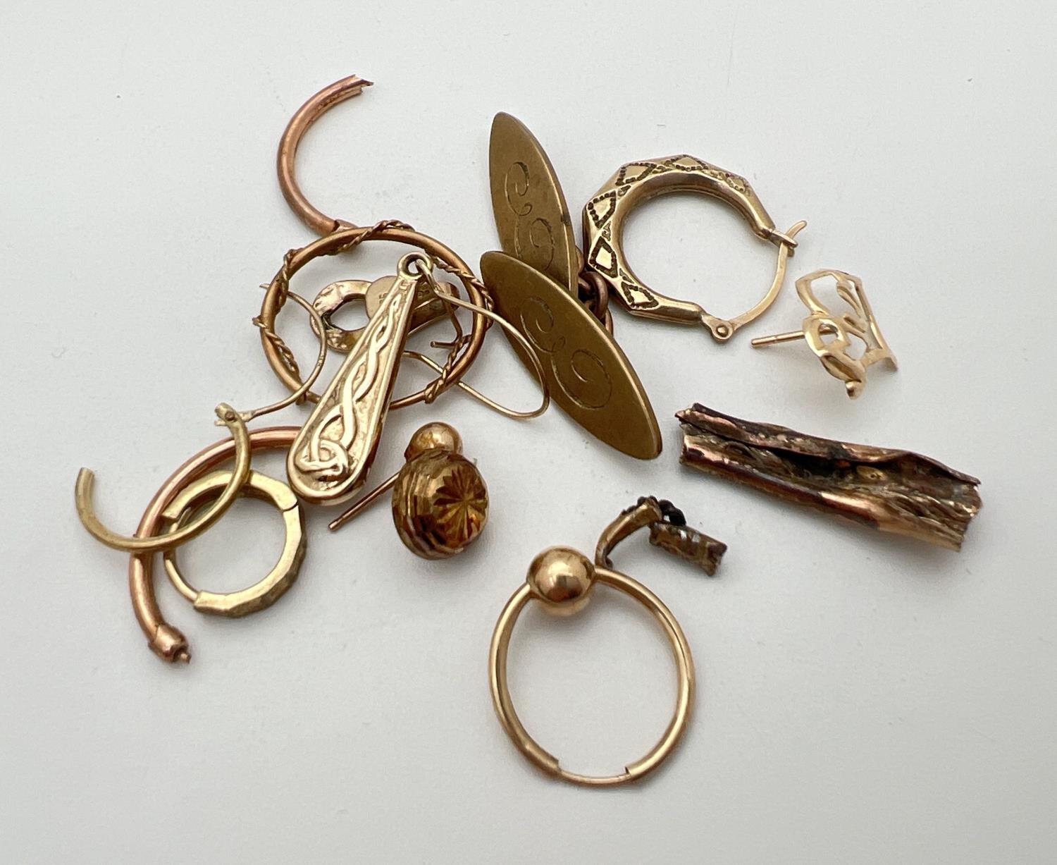 A small quantity of scrap gold to include earrings. Marked or tests as 9ct. Total weight approx. 7.