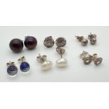 6 pairs of silver and white metal stud style earrings. To include burgundy pearl studs, white