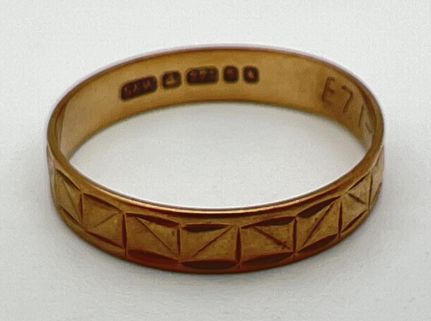 A vintage 9ct gold wedding band with square pattern throughout. Full hallmarks to inside of band.