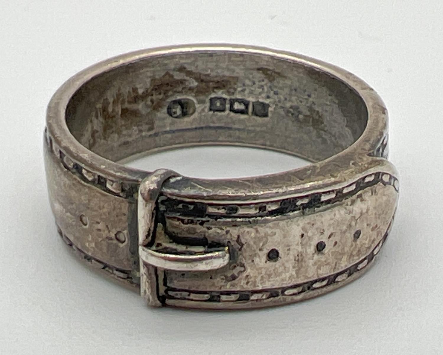 A vintage silver buckle ring. Hallmarks to inside of band for Birmingham 1969. Size N. Total