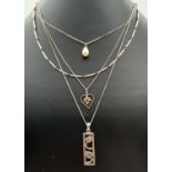 4 silver pendant necklaces. A bar and ball 16 inch chain; a floral Rennie Mackintosh style pendant