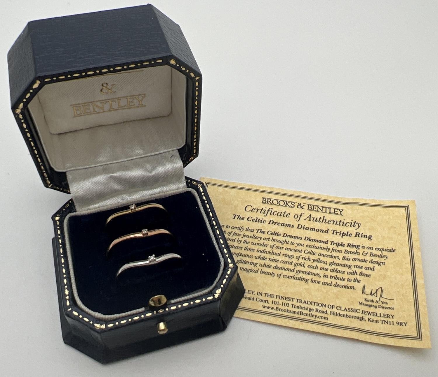 A boxed 9ct gold "Celtic Dreams" triple stacking ring set. 3 wishbone style rings each set with a - Image 3 of 4