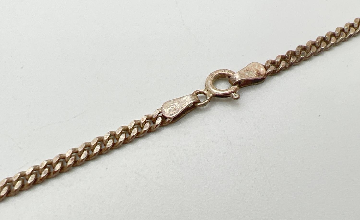 An 18" silver curb chain with spring ring clasp. Silver marks to fixings and clasp. Weight approx. - Image 3 of 3