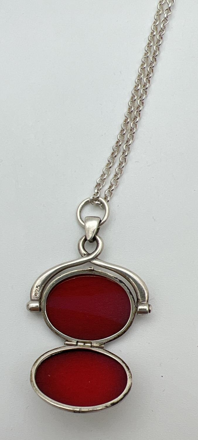 A boxed silver oval shaped spinning locket on an 18" belcher chain with spring ring clasp. Pendant - Image 3 of 4