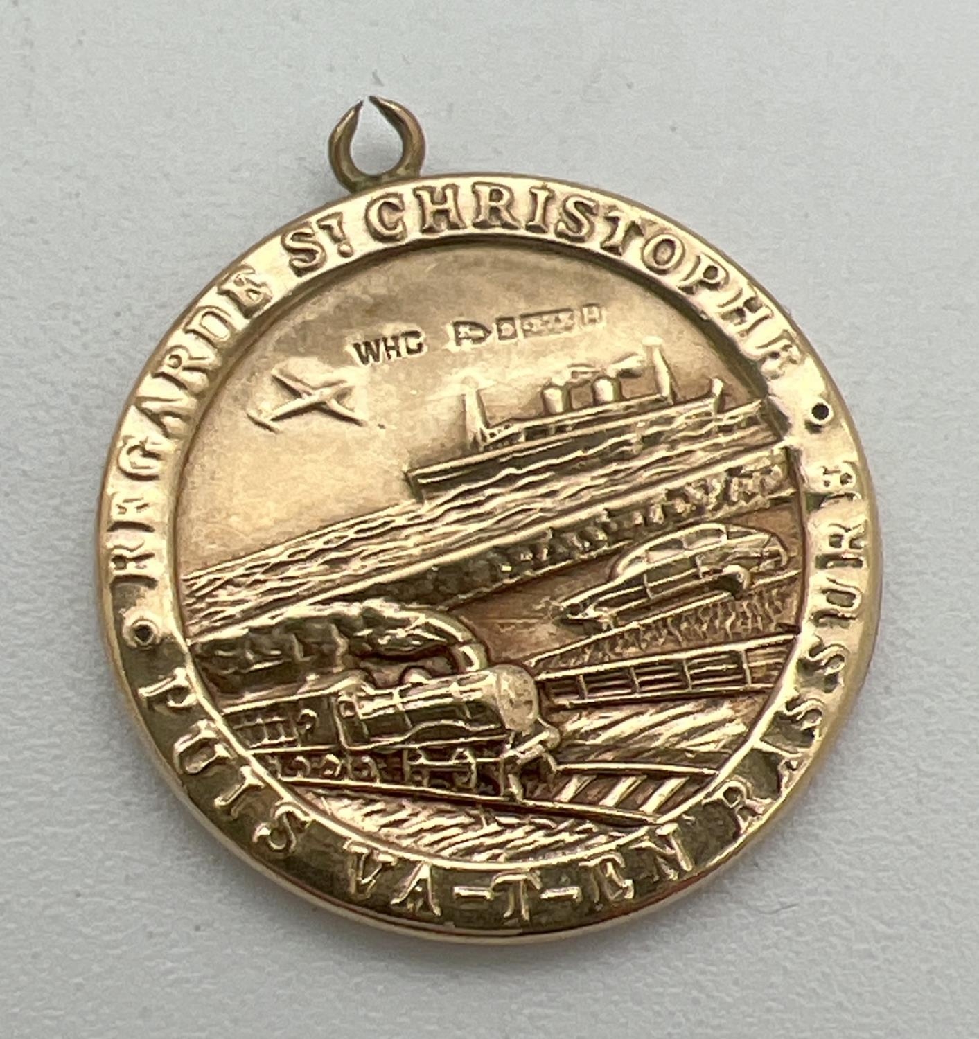 A vintage 9ct gold St. Christopher pendant with train, plane, car and ship detail to back. Fully - Image 2 of 2