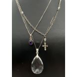 3 silver and white metal pendant necklaces. A small oval amethyst pendant on a 16" fine curb