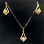 A 9ct gold and pearl pendant with matching drop earrings. Pendant on an 18" fine belcher chain