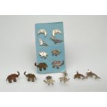 7 pairs of white metal animal and bird shaped stud style earrings. To include elephants, dolphins