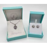 2 boxed items of silver jewellery. A stone set Claddagh pendant on an 18" belcher chain, together