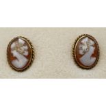 A pair of 9ct gold oval shaped cameo stud style screw back earrings with rope design to mounts. Each