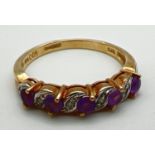 A 9ct gold half eternity ring set with alternating round cut diamonds and amethysts, in twist design