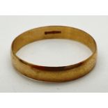 A 9ct gold plain 4mm wide wedding band. Hallmarks to inside of band. Size W. Total weight approx.