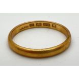 A 22ct gold 3mm wide wedding band. Full hallmarks inside band. Size RÂ½. Weight approx. 3.6g.