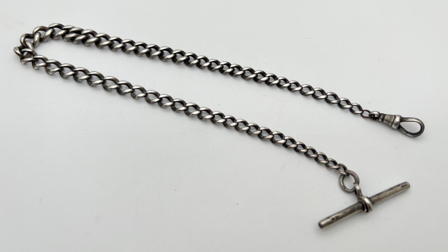 A vintage silver 14 inch Albert watch chain. Worn silver marks to fixing link and lobster clasp.