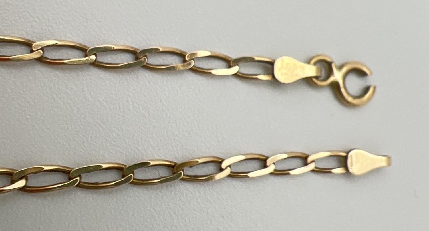 A 9ct gold 18" curb chain with spring ring clasp (clasp needs attention). Gold marks to fixings. - Image 2 of 3