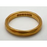 A vintage 22ct gold wedding band. Full hallmarks to inside of band. Size J. Total weight approx. 4.