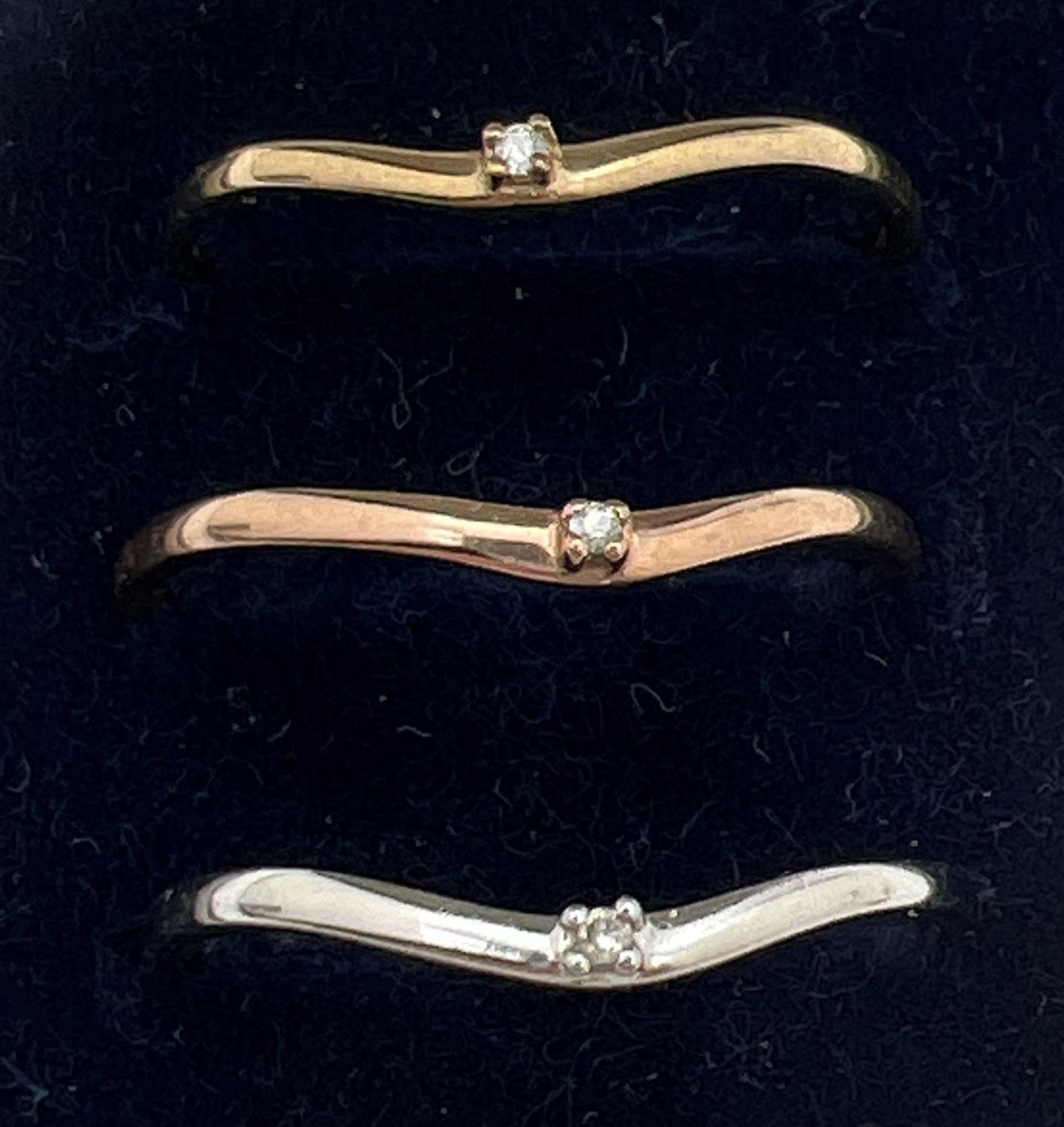 A boxed 9ct gold "Celtic Dreams" triple stacking ring set. 3 wishbone style rings each set with a - Image 2 of 4
